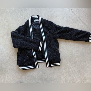 Girls medium size sweater in black.